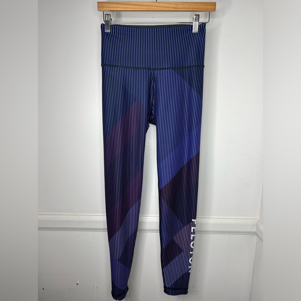 PELOTON (WITH)- black and purple striped leggings size medium